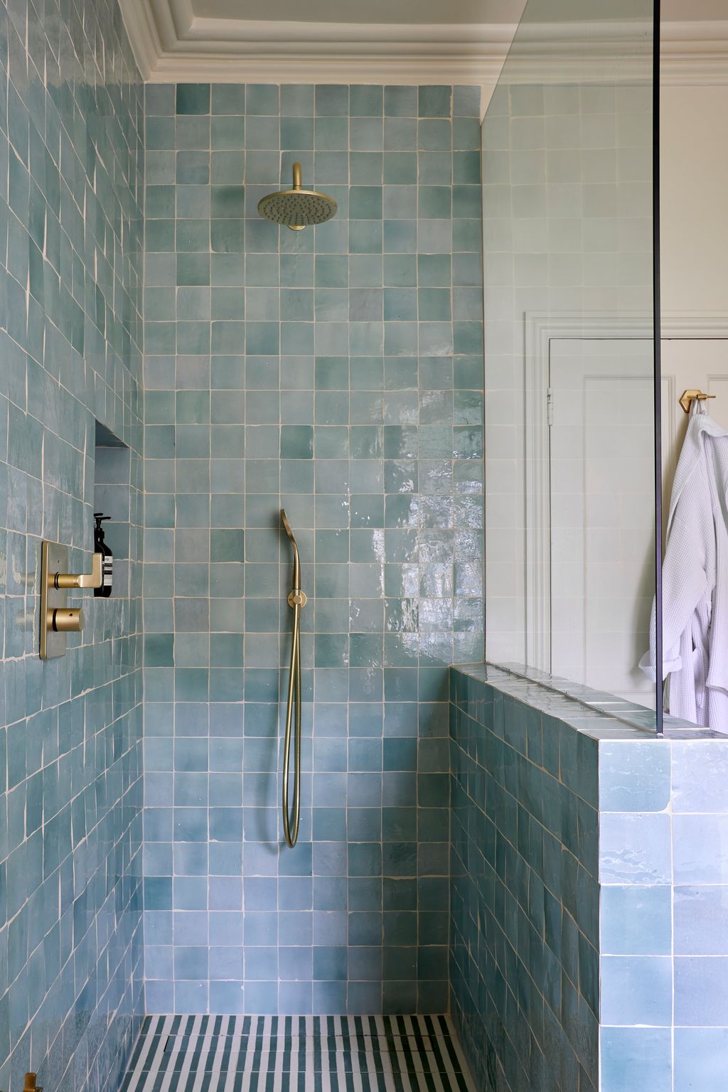A fan of Zellige tiles Tiffany opted for a pale blue in the main bathroom. The colour is a running thread throughout the...