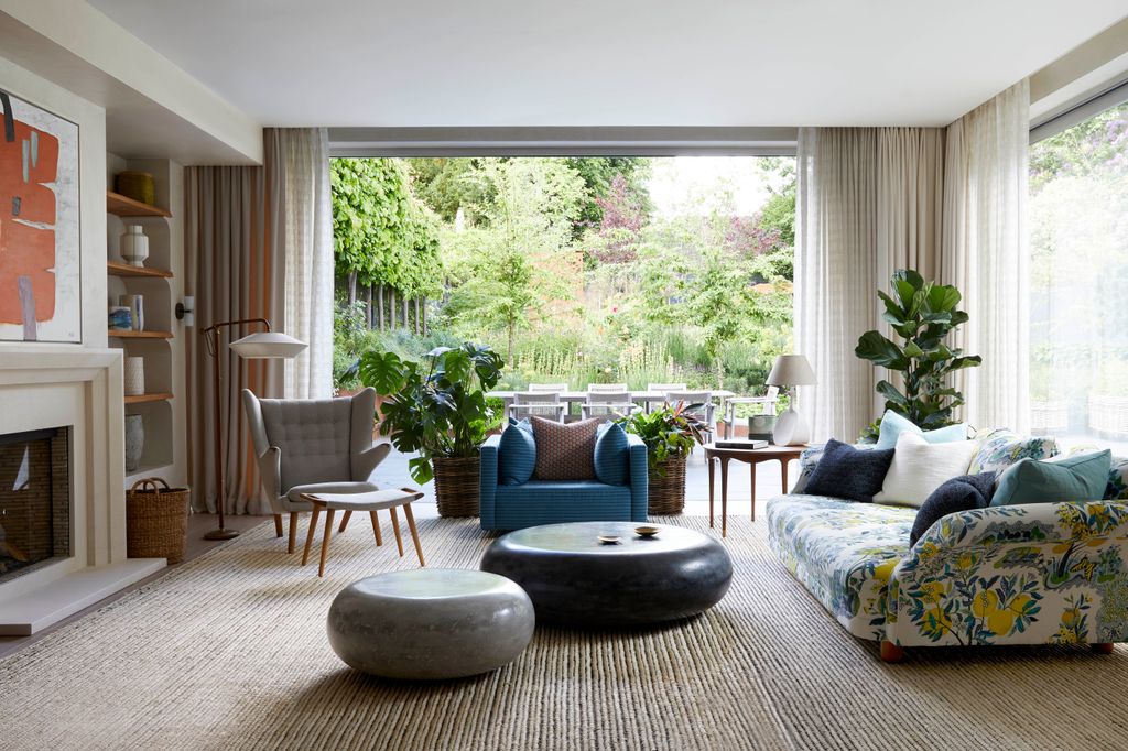 Image may contain Furniture Living Room Indoors Room Couch Table Chair Coffee Table and Rug