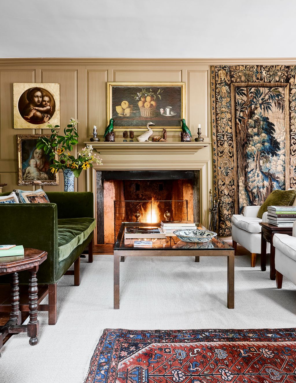 In the antique dealer Dana Jennings' New England house panelling in Benjamin Moore hue called ‘Jamesboro Gold provides a...