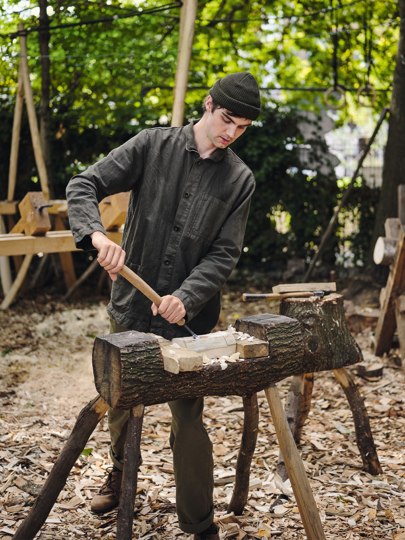 Samuel Alexander working on a carved vessel.