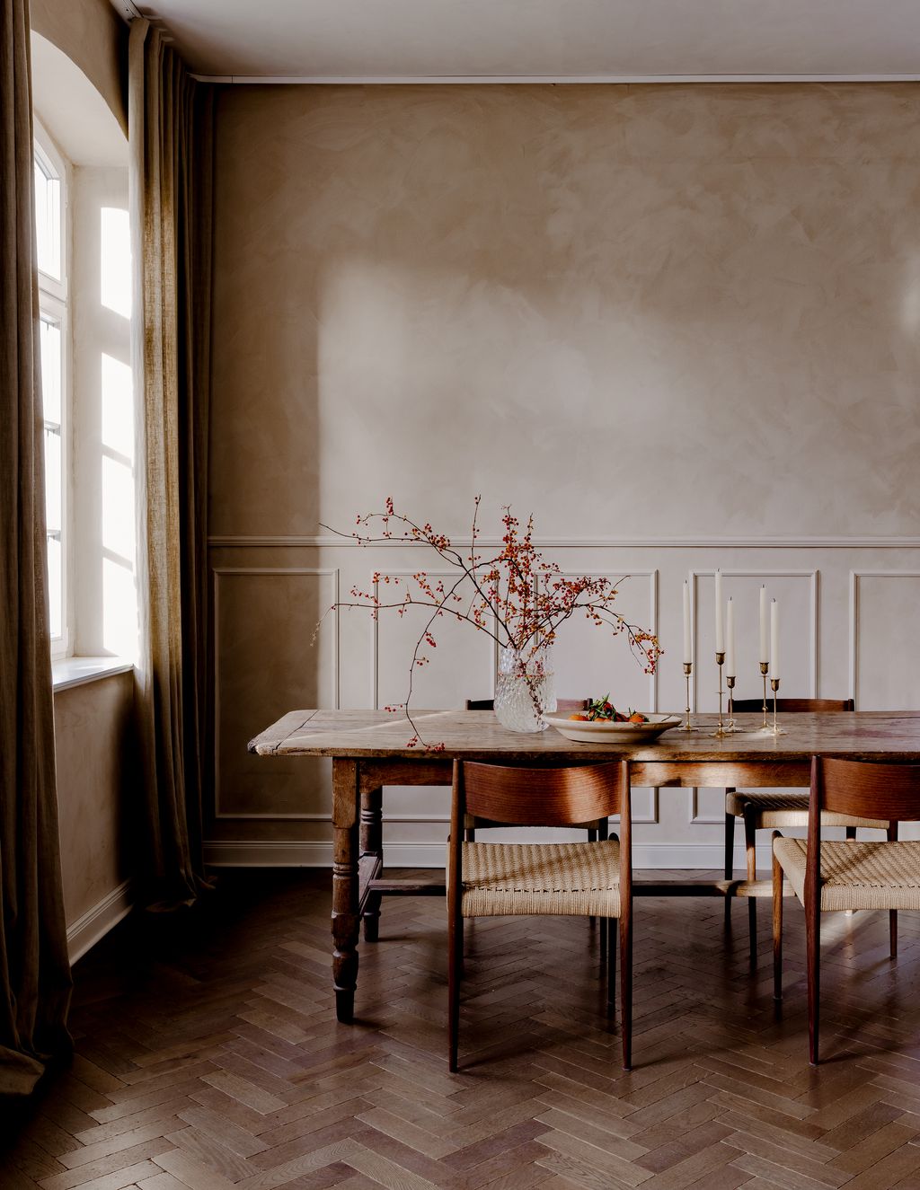 This dining area with an antique table from Lorfords and Pia chairs from dk3 is at the other end of the kitchen.