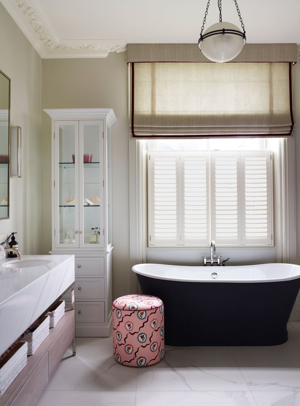 The CP Hart bath is paired with a vanity taps and mirrors from Porter Bathroom and a Hector Finch ‘Globe Prism light.