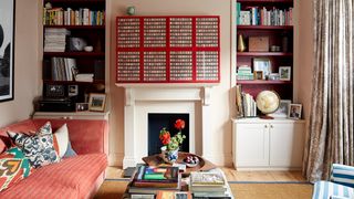 In the living room the walls are painted in Farrow  Ball's Setting Plaster No 231. For contrast the interior shelving...