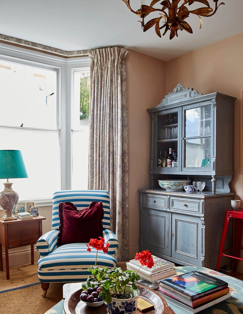 A marbleised lamp found in a French brocante has been partnered with a Pooky shade in Jade Taj silk. The striped...