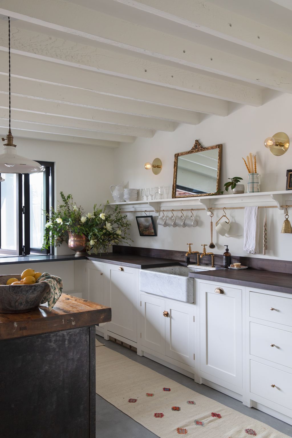 The bifolding window in the kitchen is one of Hana's favourite details in her design. “You can be sitting outside whilst...