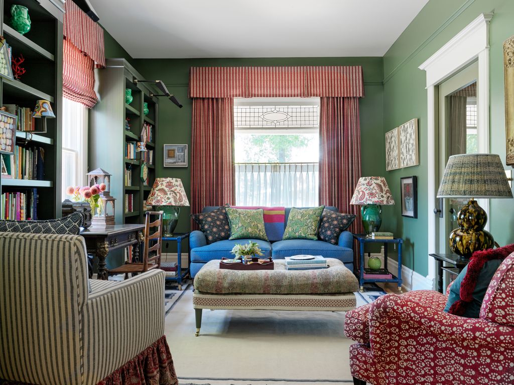 In the sitting room the interior designers layered two shades of green for a cocoonlike effect—Farrow Balls Calke Green...