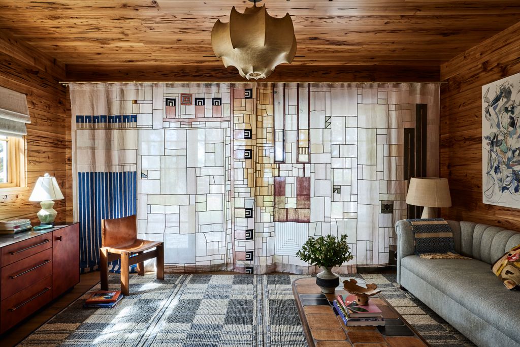 Against a backdrop of Pecky cypress panels the moody study brings together the likes of a George Smith sofa Christopher...