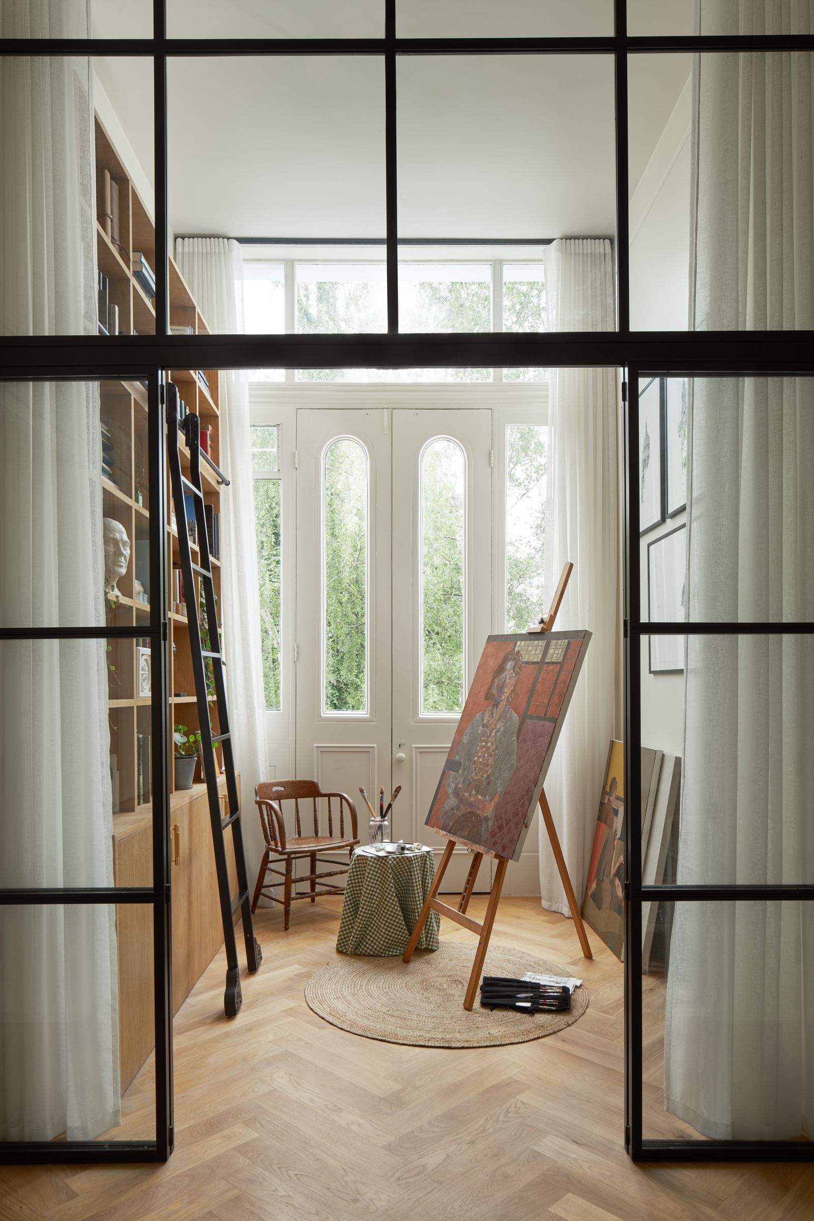 Crittal doors into the new art studio allow light to flood the hallway in this Victorian flat in Belsize Park by Alice...