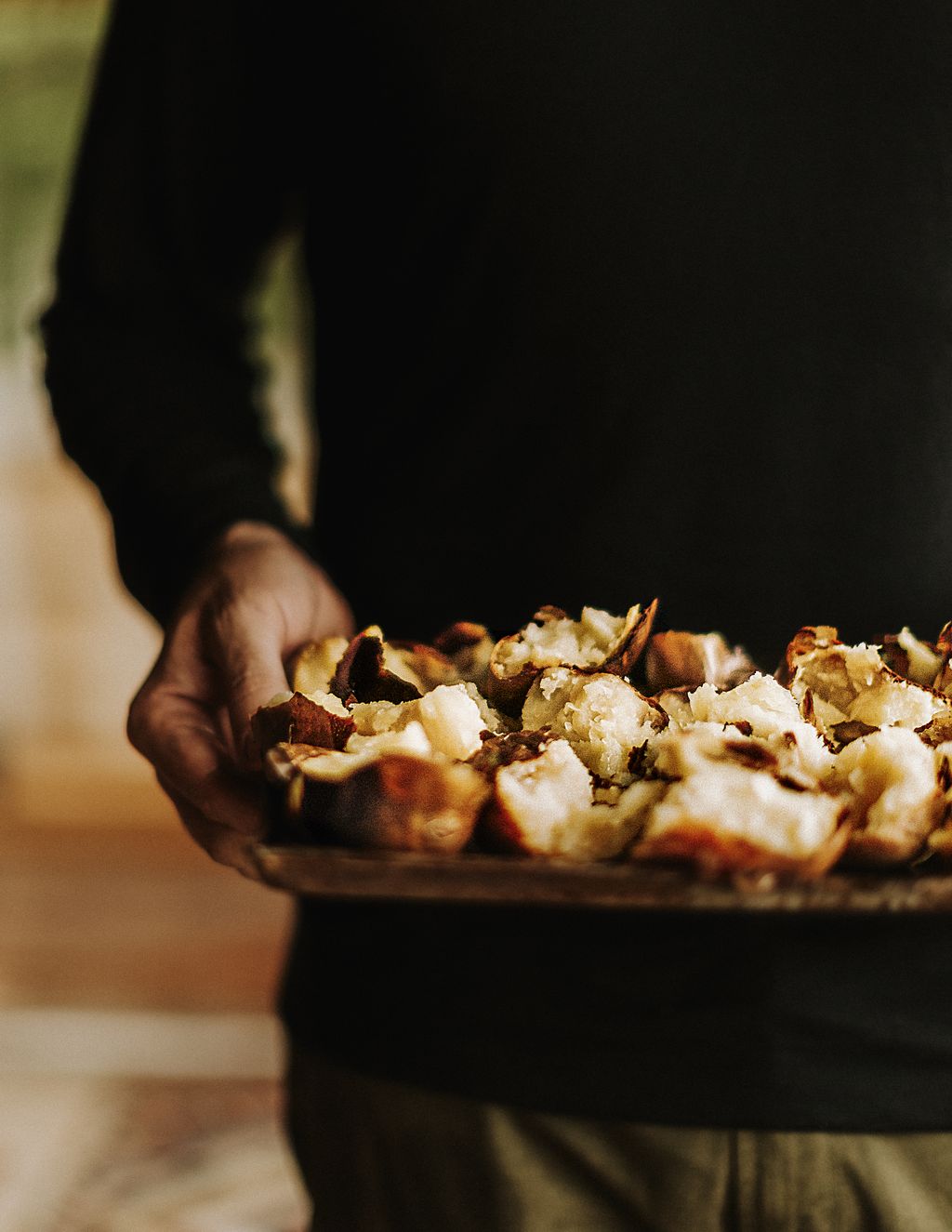 Tom with a tray of crisp baked potatoes