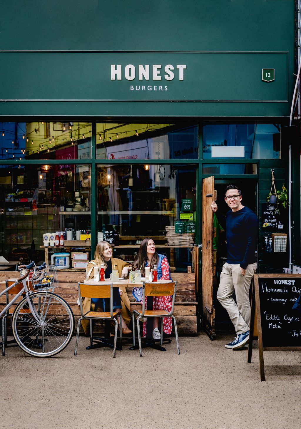 Connie Nuala Durrant and Tom outside the first Honest Burgers restaurant in Brixton Village indoor market where its...