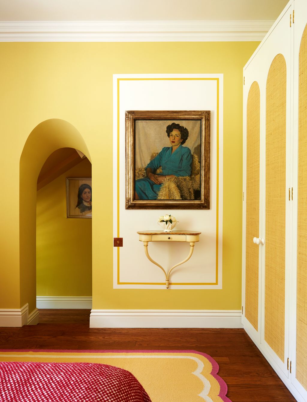 A portrait acquired by the owners hangs above a wall console found on Vinterior.