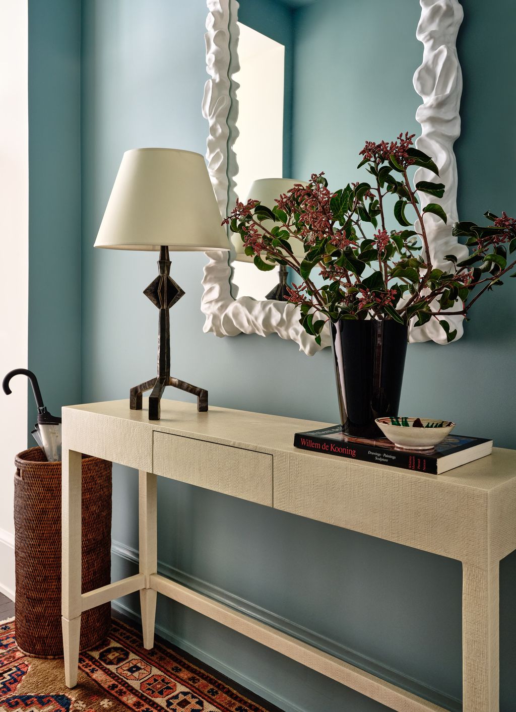 In another shot of the hallway the mirror is from Oly Studio the lamp from RT Facts and console from Made Goods.