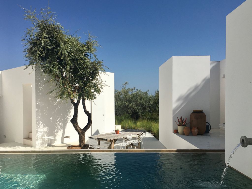 Emerging out of the verdant landscape like sugar cubes this contemporary house in the Algarve  by Lisbonbased studio...