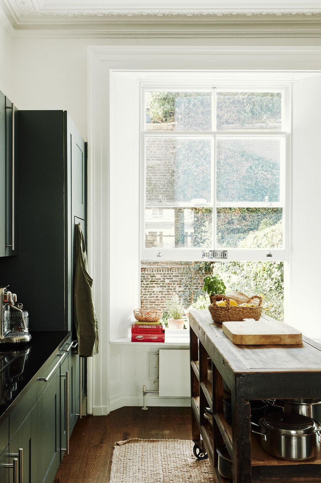 The kitchen is painted in Farrow  Ball's ‘Green National Trust.