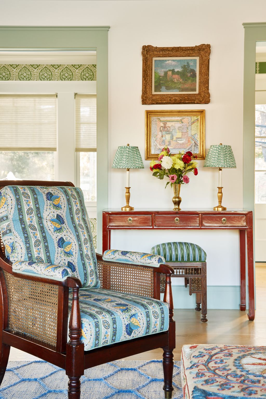 The sitting room features an antique library chair sourced by Elizabeth at a US auction house covered in Dcors Barbares'...