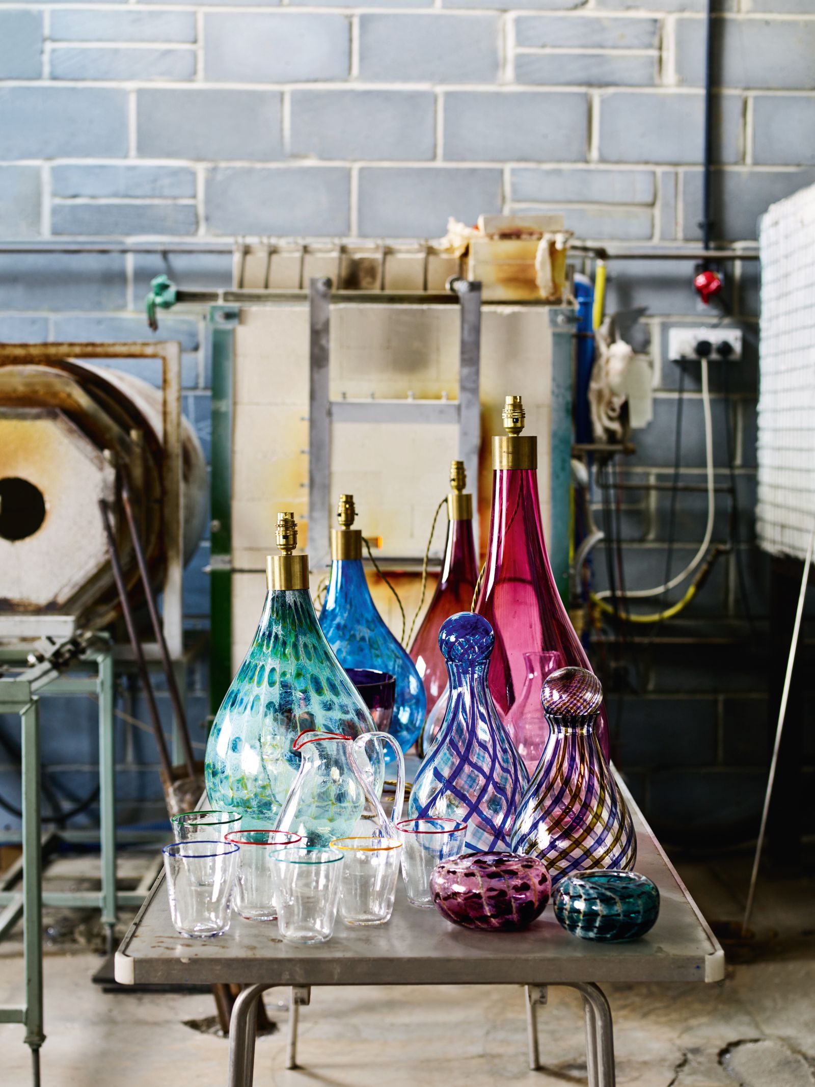 Her range of appealing glass pieces includes table lamp bases decanters decorative bowls and jugs and tumblers with...
