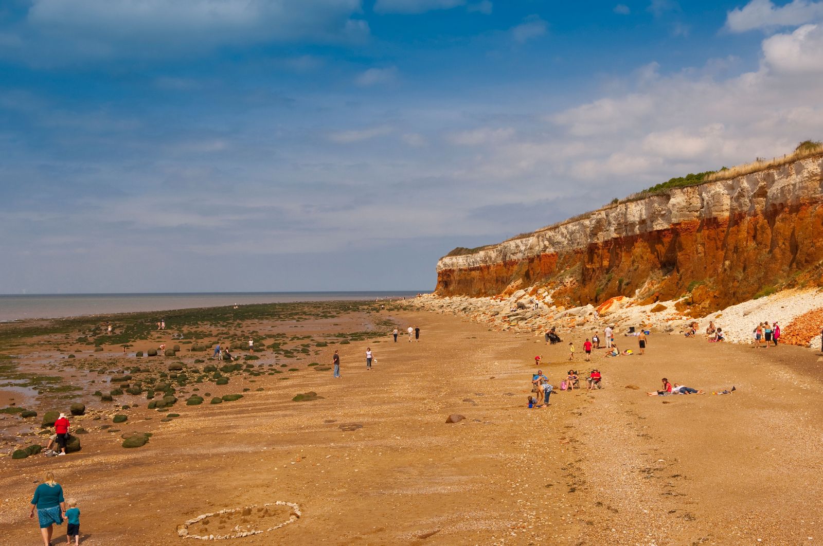 BE3YX3 The beach and cliffs with people at Hunstanton North Norfolk Uk