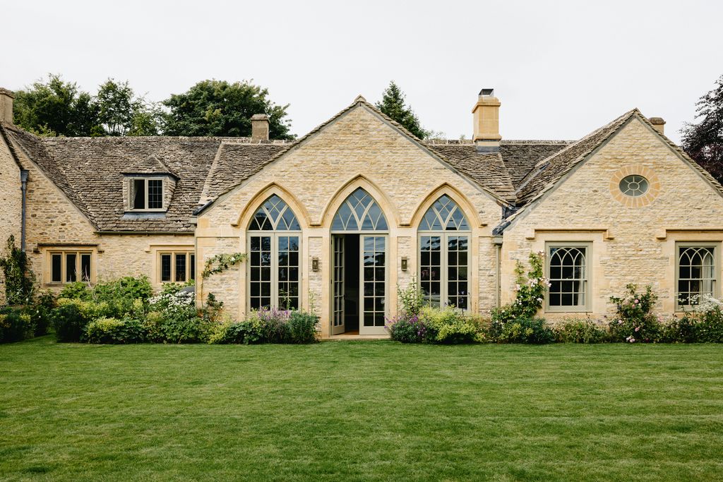 At the back of the house Gothic windows allow light to flood into the new sitting area adjoining the kitchen in what was...