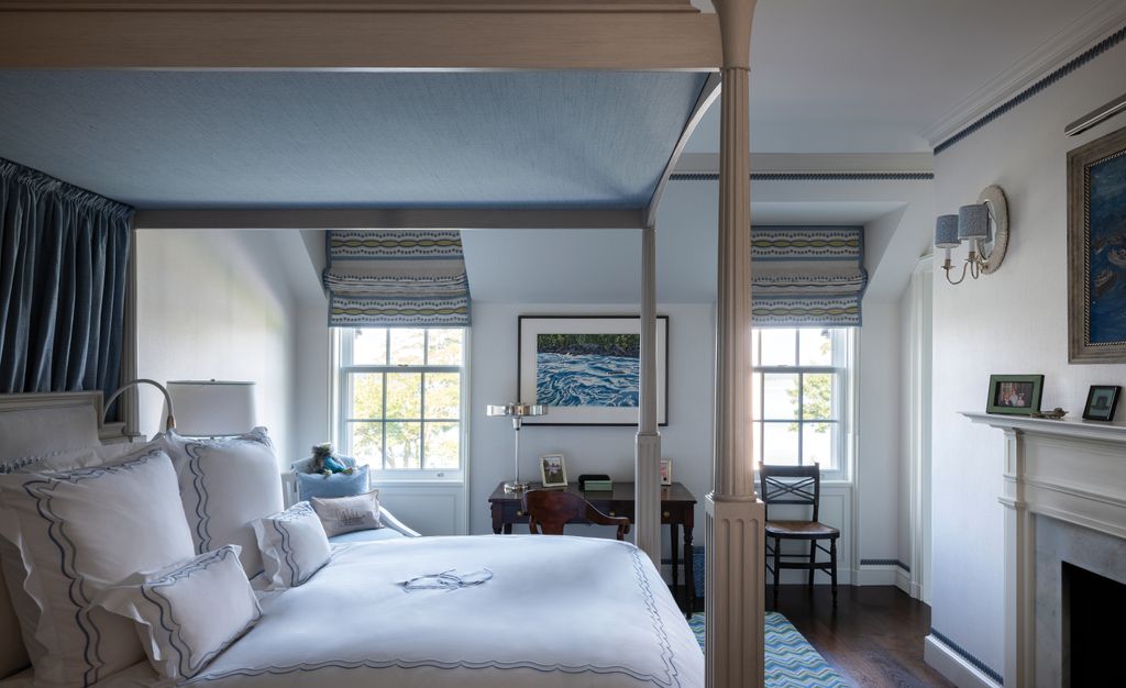 The paredback bedroom suite of the clients son is furnished with simple antique pieces that subtly evoke a period...