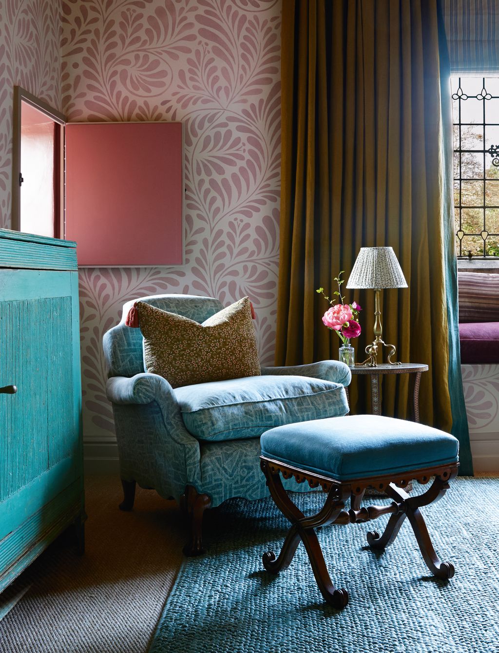A chair in Rose Tarlows ‘Lakme linen in lago stands on a Vanderhurd rug.