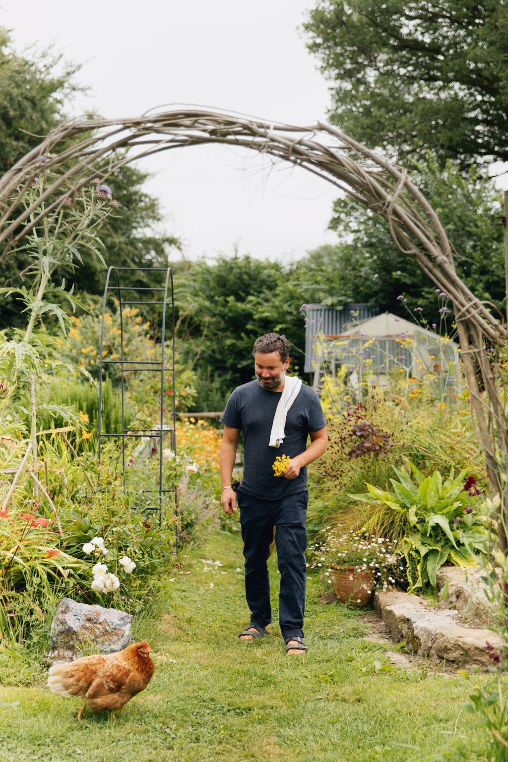 Tom seen exploring accompanied by one of her chickens  she keeps between five and nine at a time.