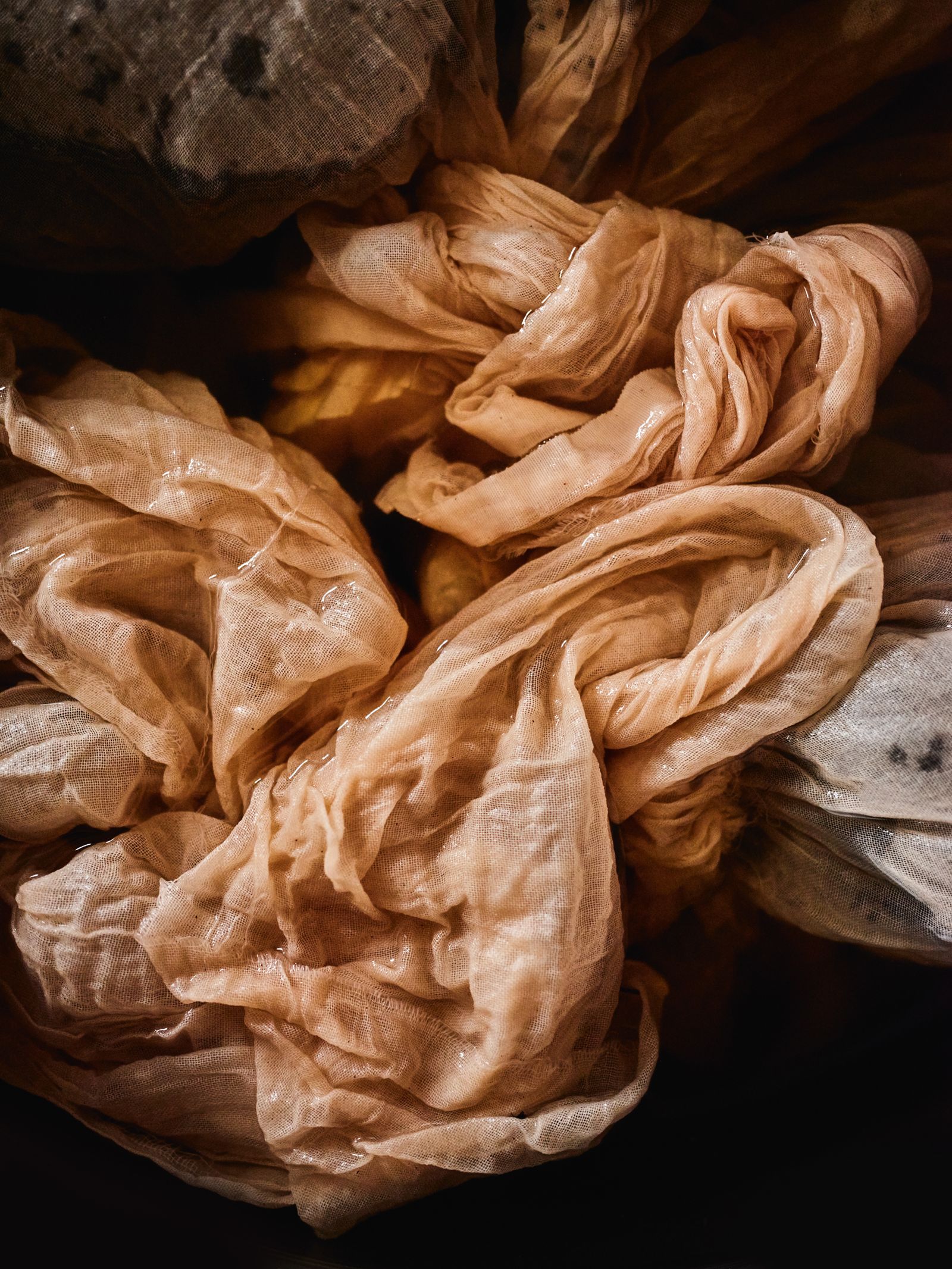 A muslin dye bundle filled with dock seeds that harness a bespoke peach shade for Laura ButlerMadden.
