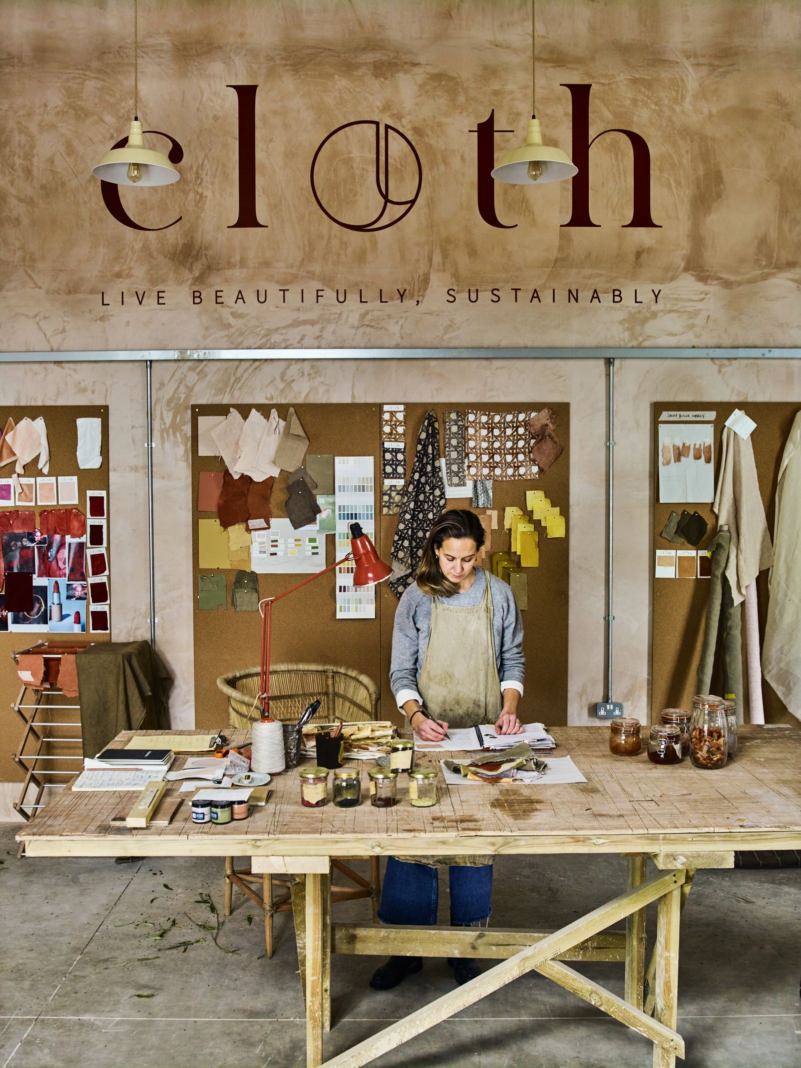 Charlotte noting down new dye sampling recipes for a client