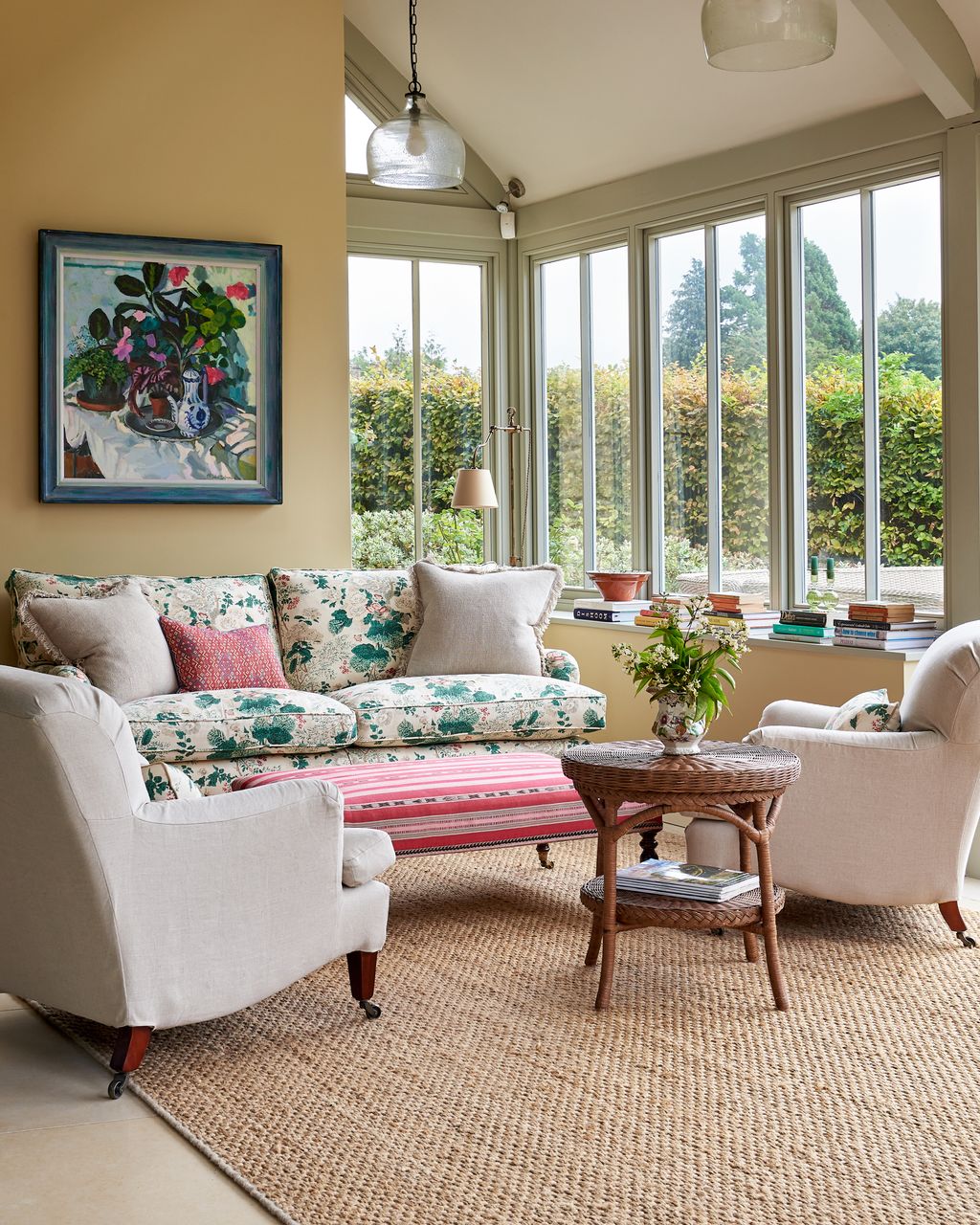 In the sitting area in the kitchen painted in “Cord” by Farrow Ball features two “Colridge” chairs from OKA.