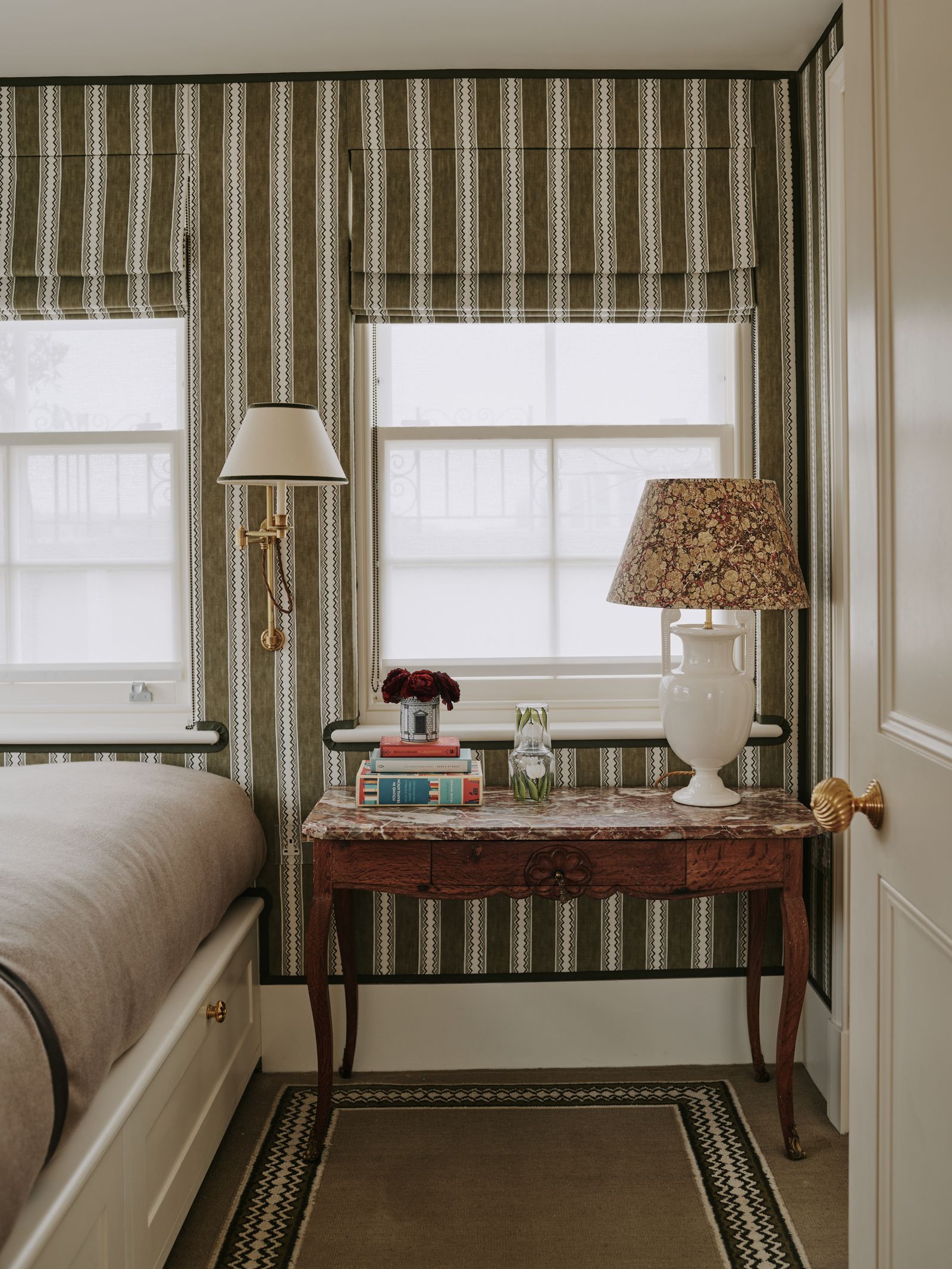 Trims can also be a good way to provide a tidy border for a patterned wallcovering as seen here in a Mayfair piedàterre...