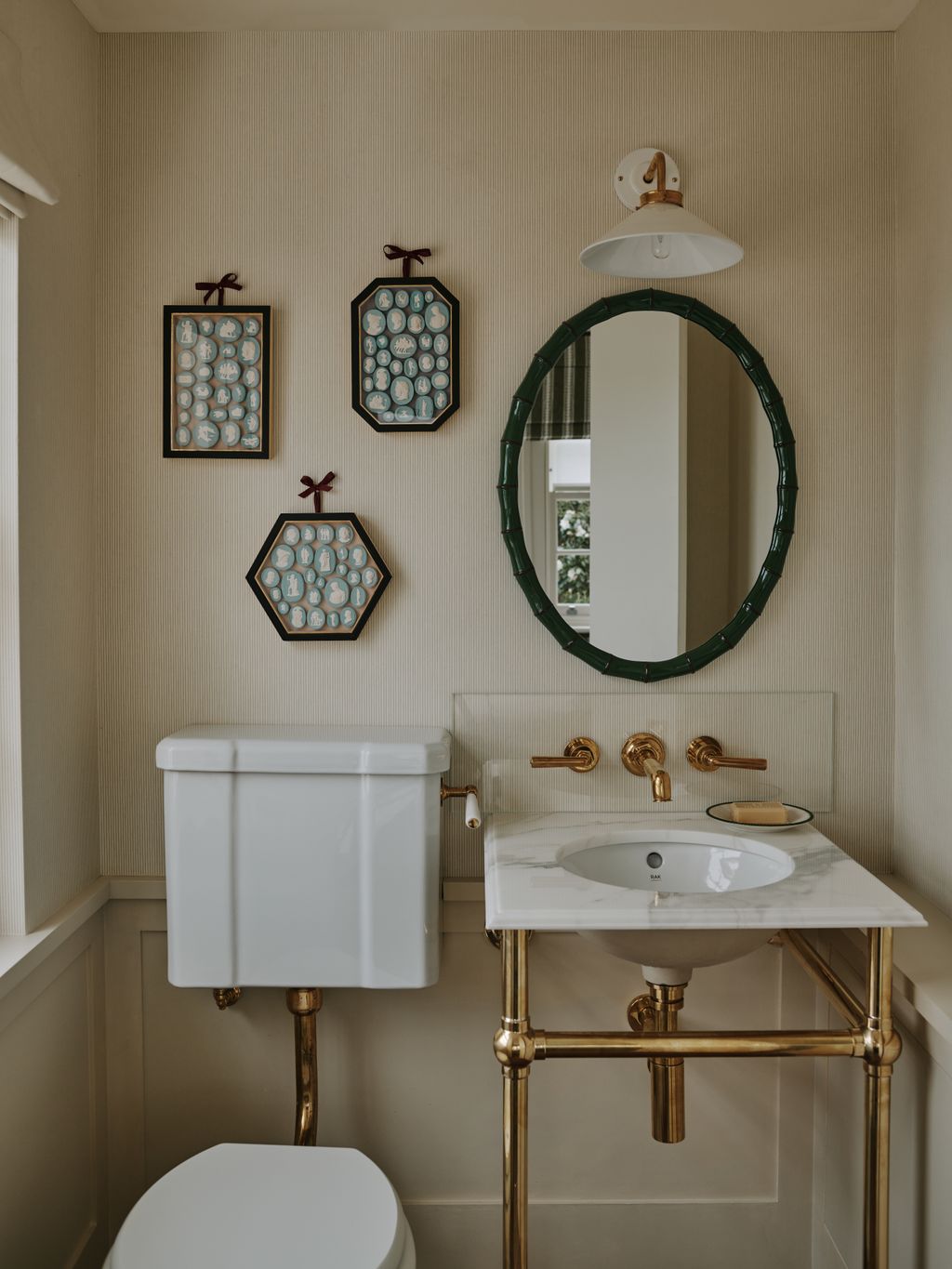 The framed entaglios in the loo are from Birdie Hall.