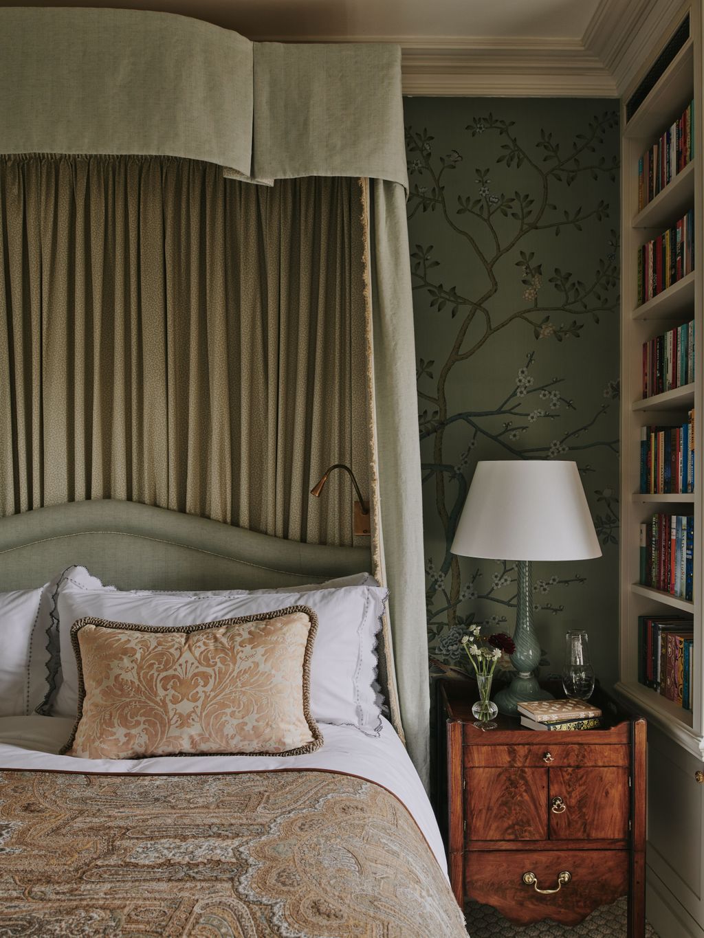 The bed tester with inside fabric from Claremont helps to achieve the very English style the client was looking for.