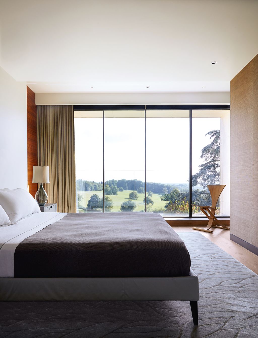 A ‘Monogram rocking chair by New Zealander David Haig is showcased in the doorway. The BB Italia bed stands on an Emily...