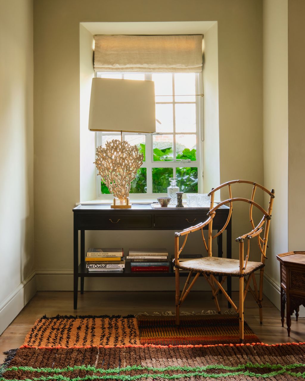 The coral lamp was sourced from Adam Bray. On the floor are a selection of rugs including Moroccan rag rugs from Larusi...