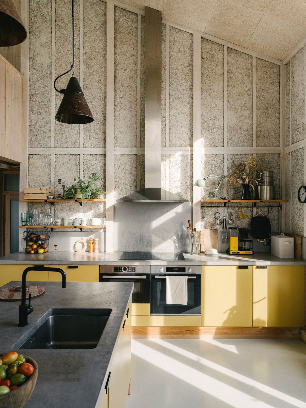 Yellow can also be a striking choice for a contemporary kitchen as this modern farmhouse in the Cambridgeshire...