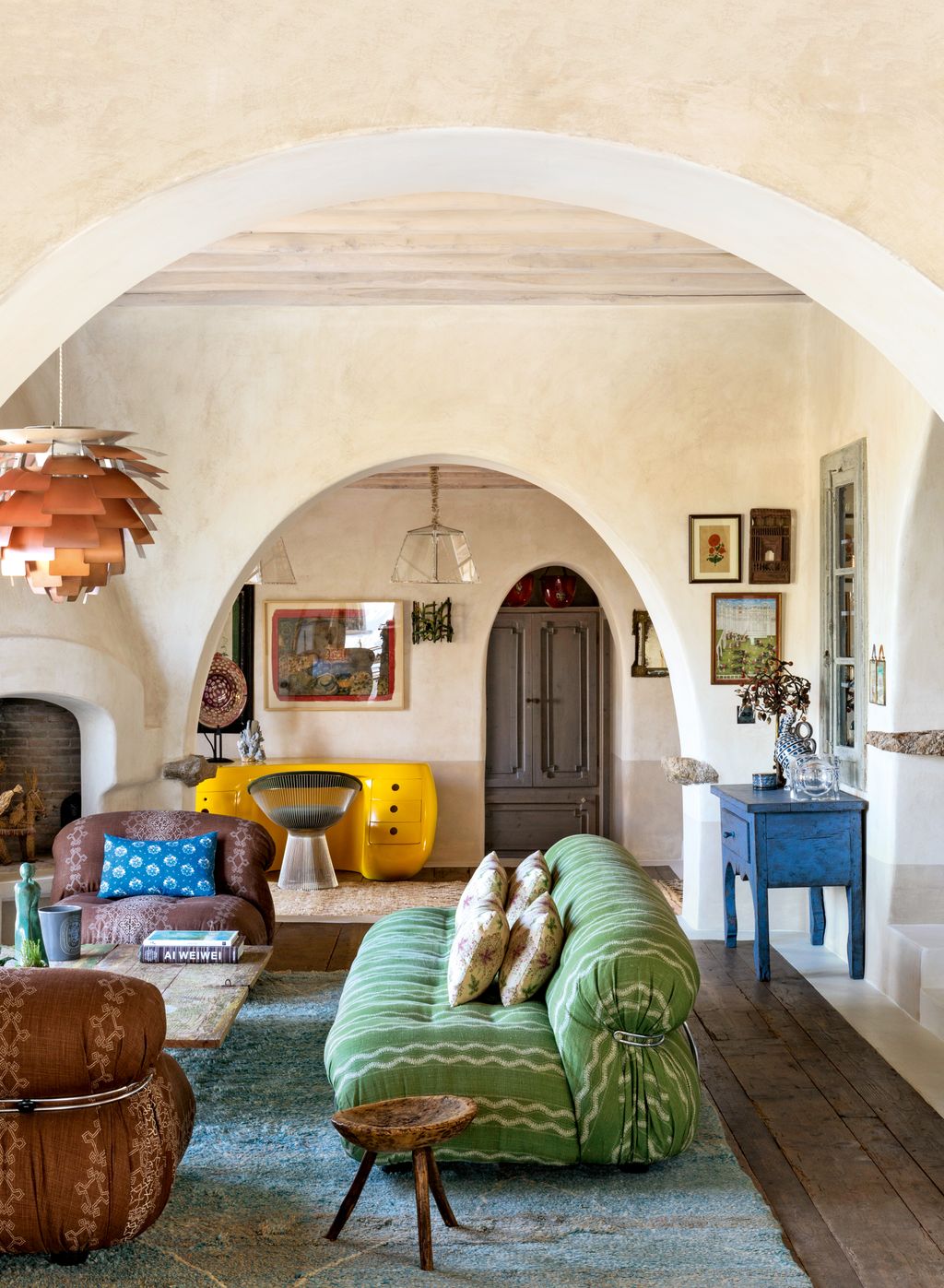 In the family room a vintage Afra and Tobia Scarpa sofa is covered in Peter Dunham Textiles ‘Zanzibar green linen with...