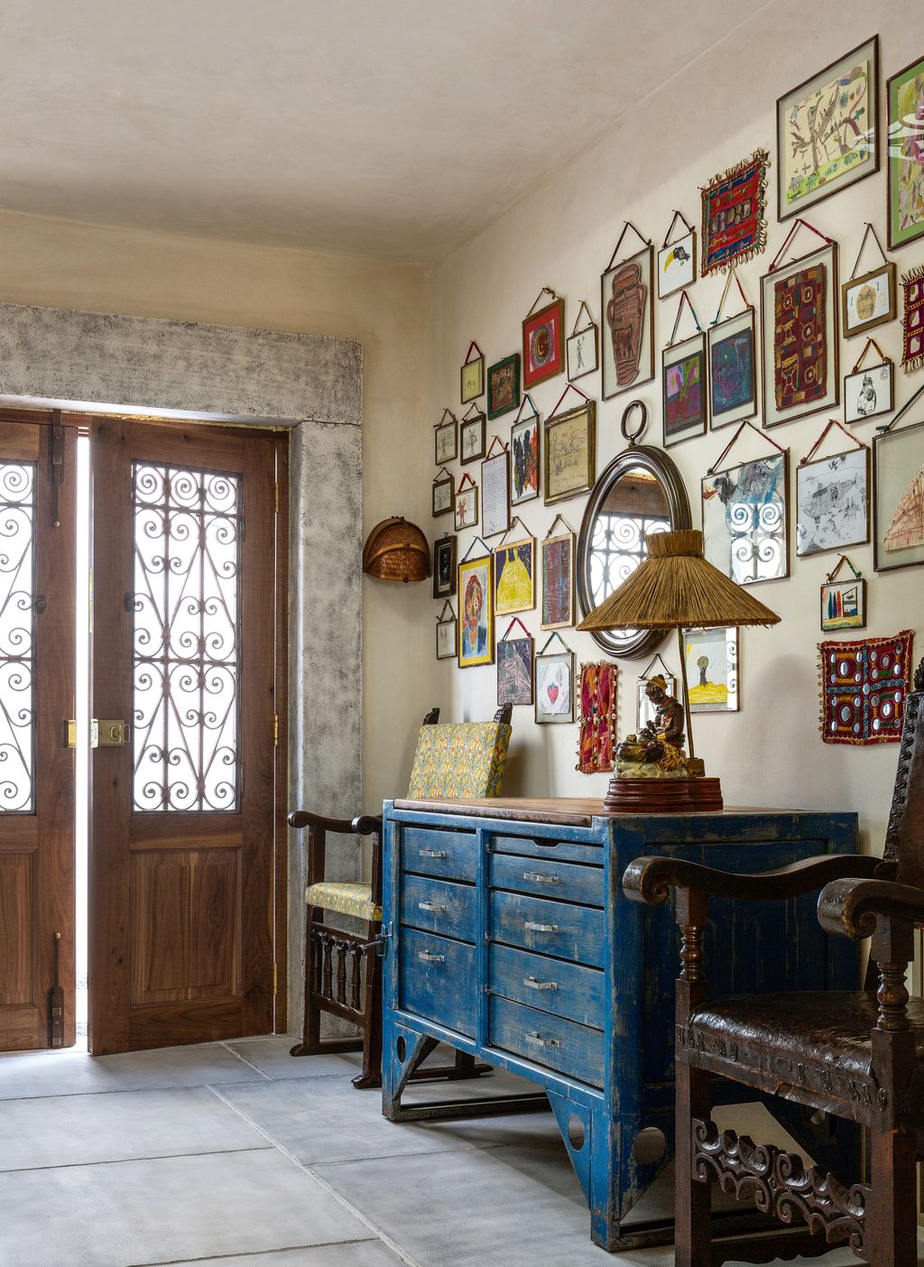 In the hall artwork by Rebeccas children hangs above a Forties Czech workbench.