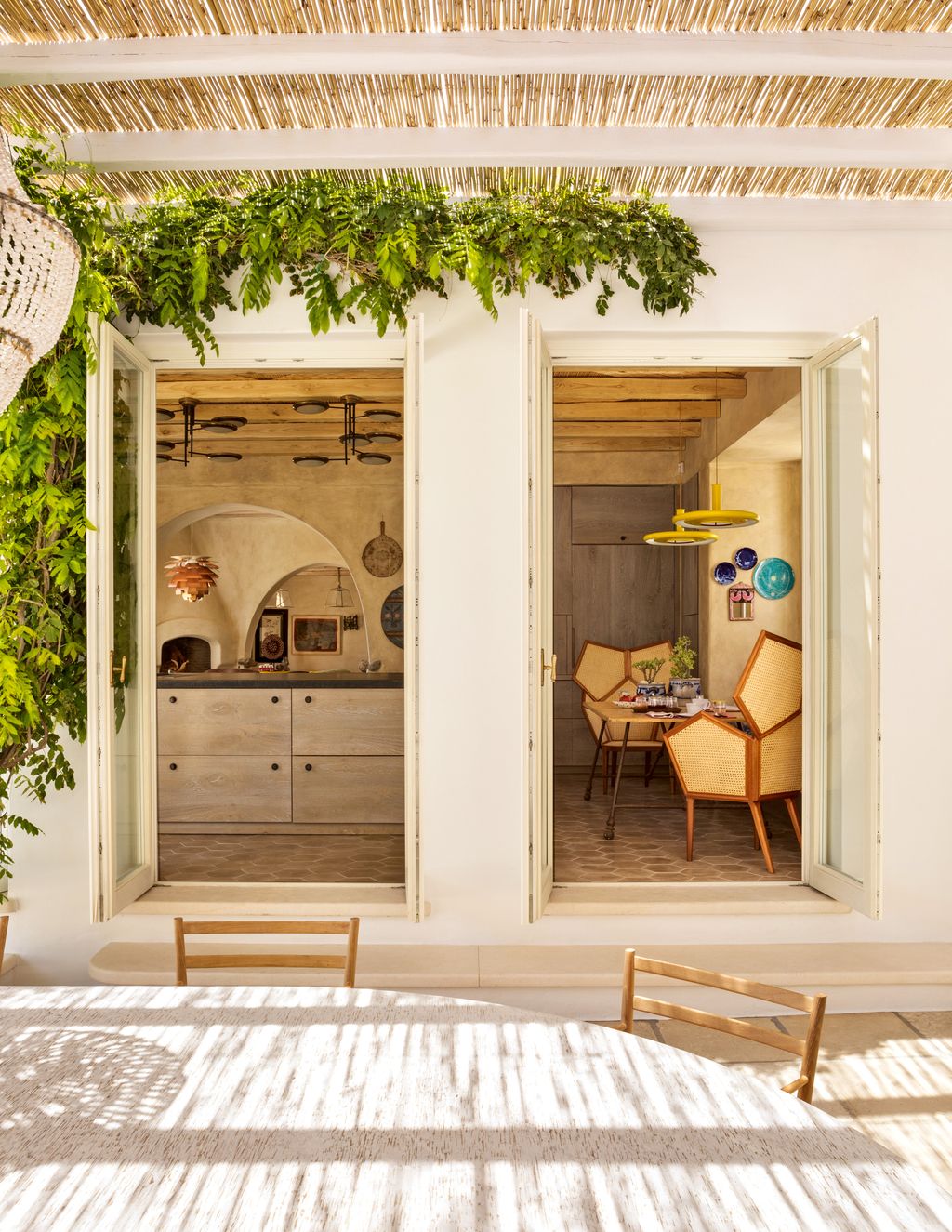 A bespoke marble table occupies a shaded part of the terrace near the kitchen.
