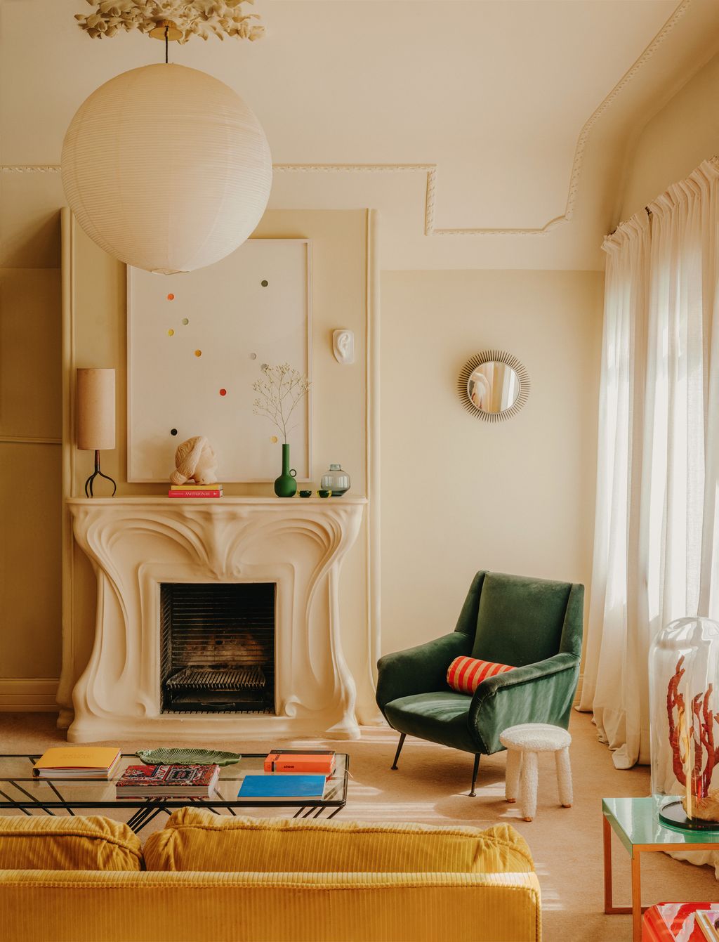 The sitting room of Sergio Roger's apartment in Barcelona has simple skinny mouldings and a curvaceous Art Nouveau...