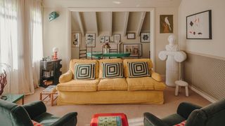 A sofa in yellow corduroy from Güell Lamadrid is teamed with cushions by Christina Lundsteen which pick up on the...