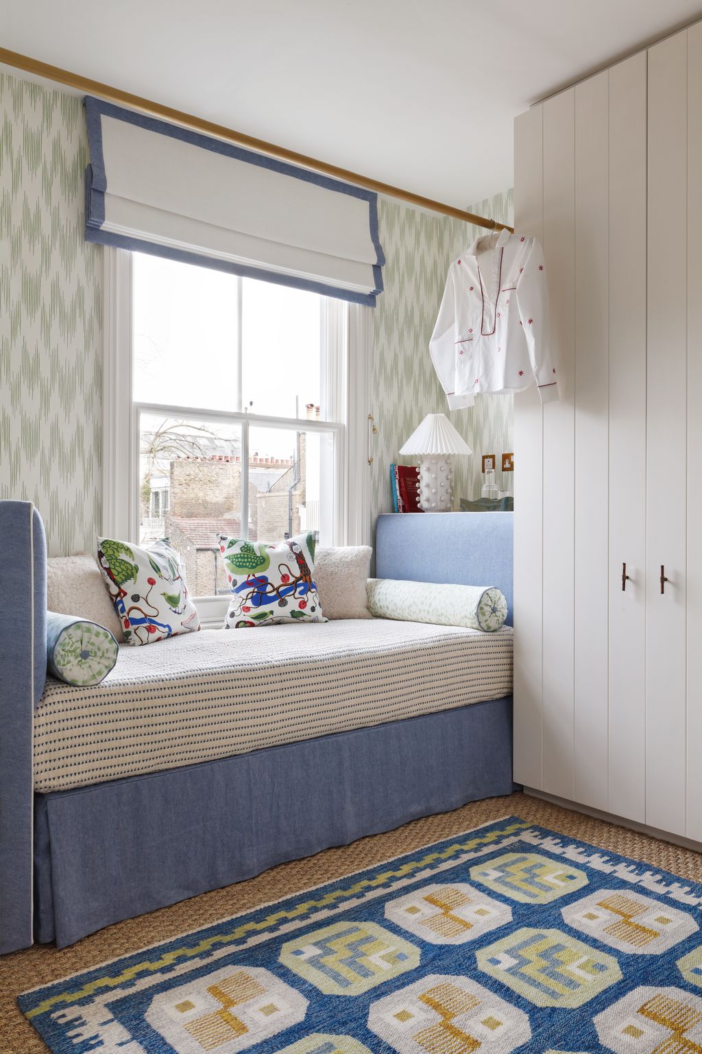 Svenskt Tenn cushions and a Robert Stephenson rug add bold pattern.