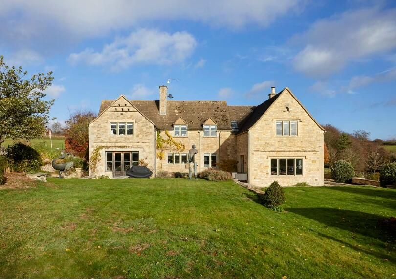 The house has large gardens and 8 acres of land.