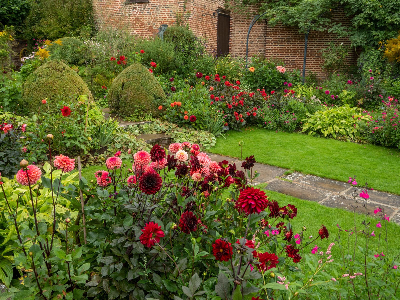 Downham Royal dahlias make up the lovely border of a walled garden at the Grade I listed Tudor Chenies Manor in...
