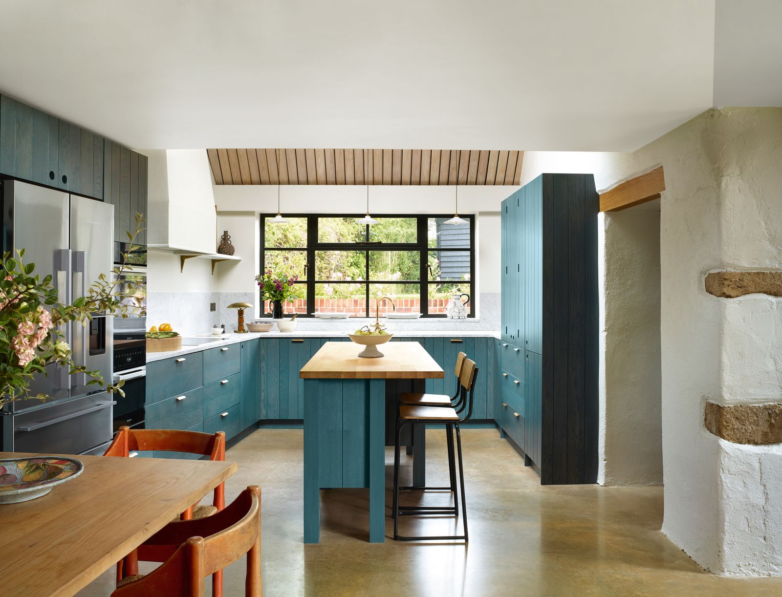 Together with the Crittall windows and larch ceiling the polished concrete floor and walls painted in Farrow amp Balls...