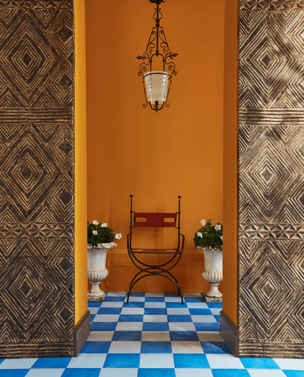 ‘Dutch Orange 75 for 2.5 litres dead flat from Farrow  Ball.  Handcarved hardwood geometric panels 450 a square metre...