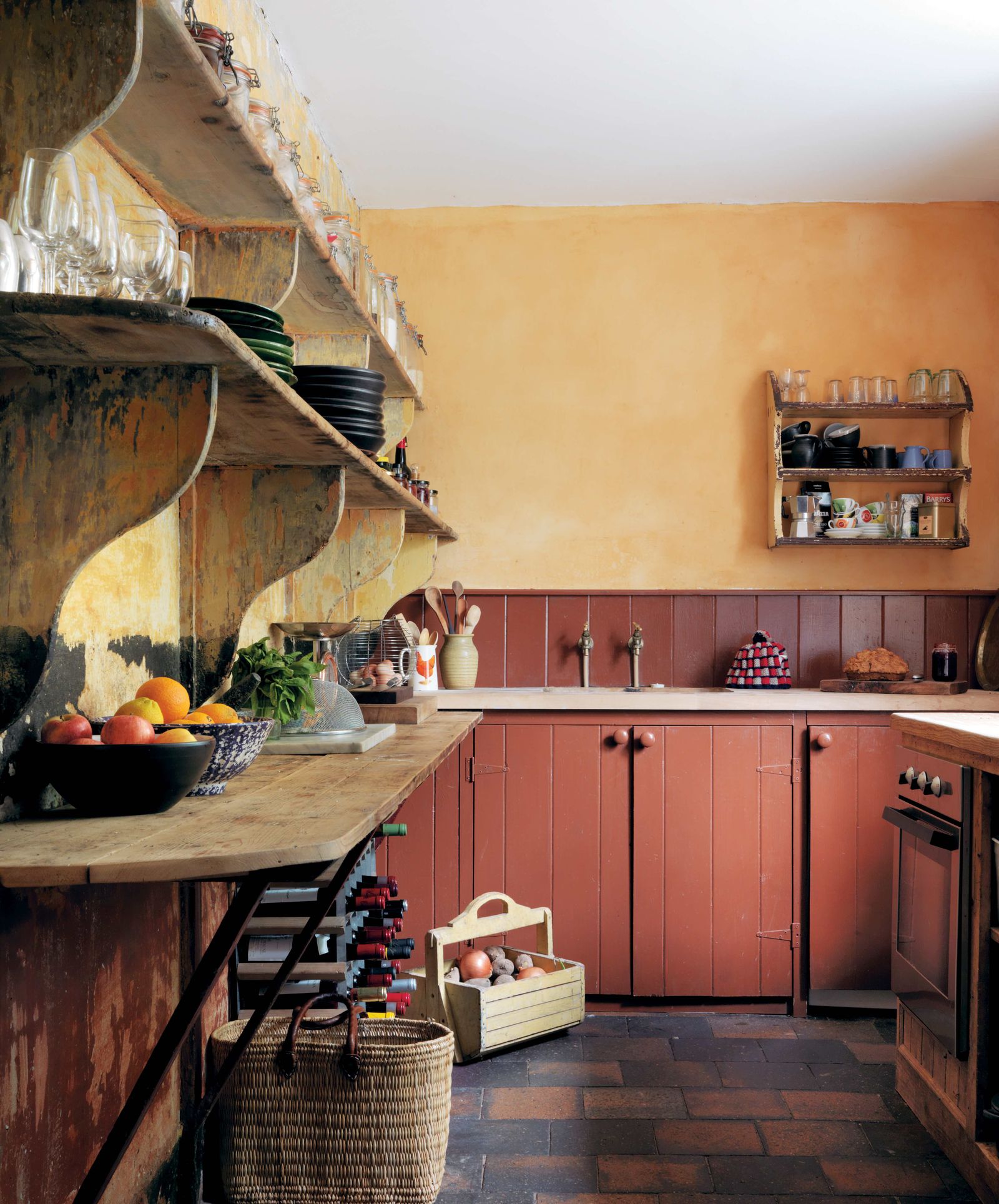 This Irish farmhouse kitchen features traditional ochre walls which showcase how a sheer wash of peach can be quite a...