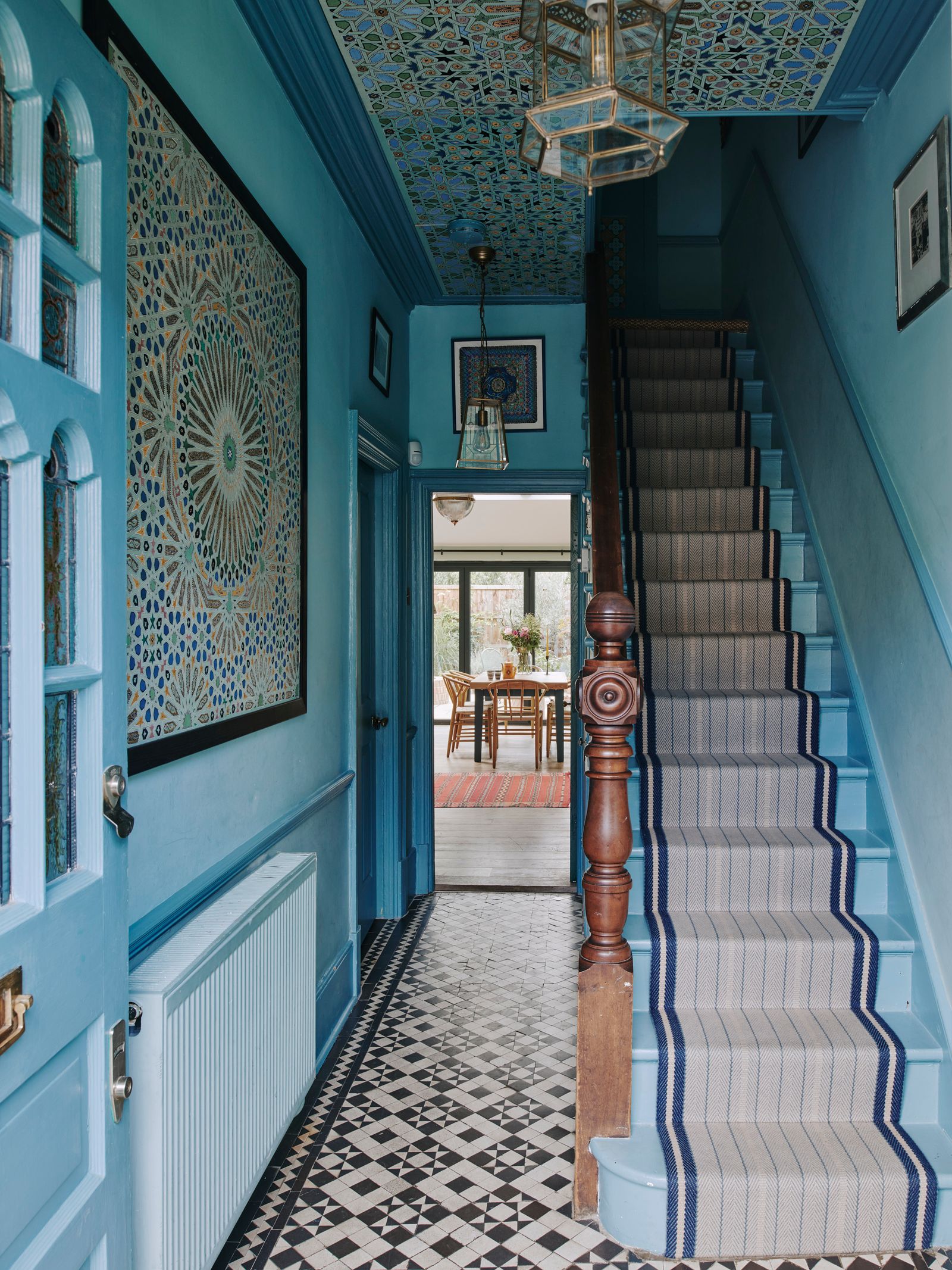 The staircase runner in the entryway of Natasha Mann's London home is traditional but still playful