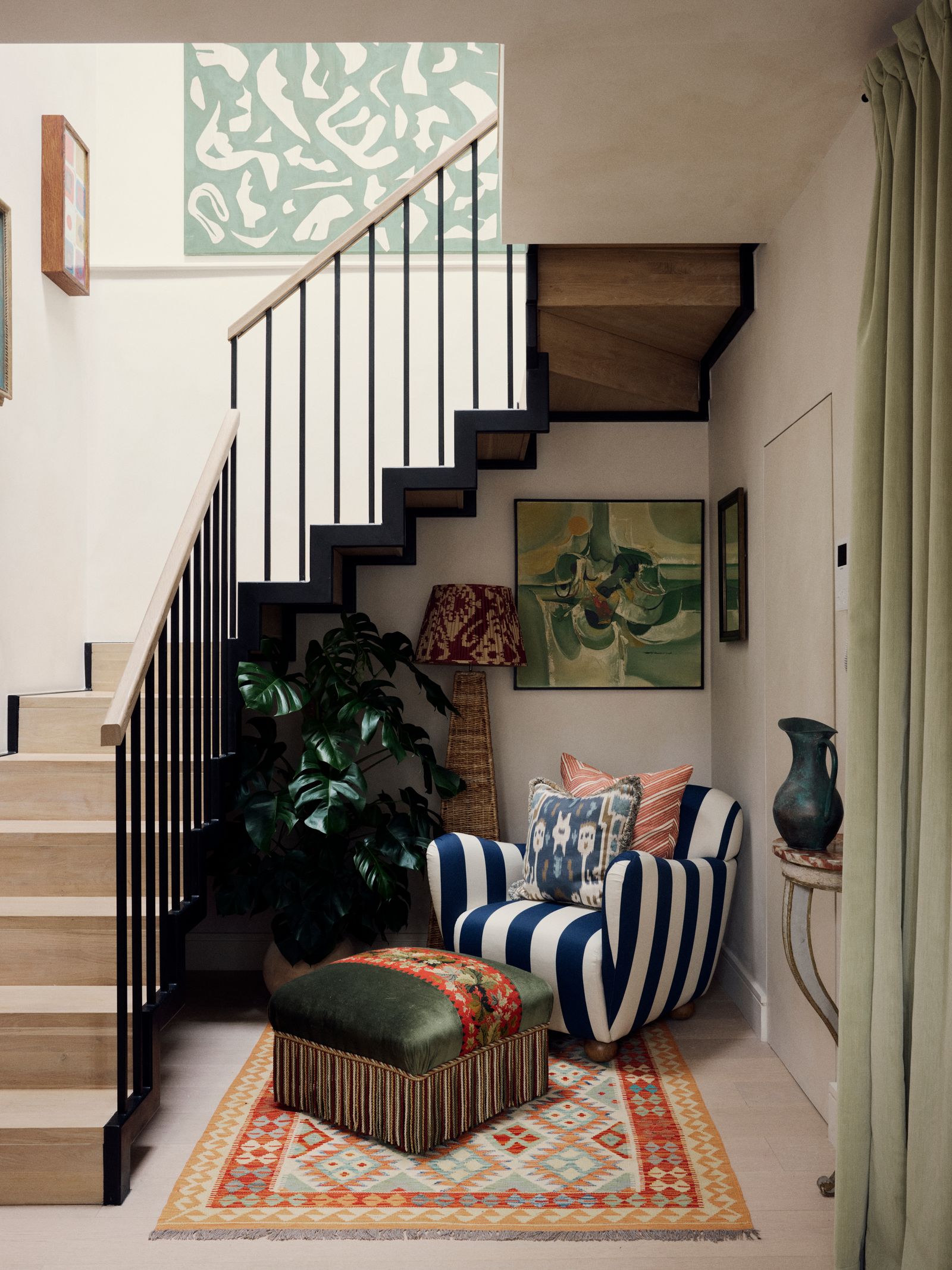 In what could have been a dull corner under the stairs Orlagh has created a colourful reading spot. The armchair is from...