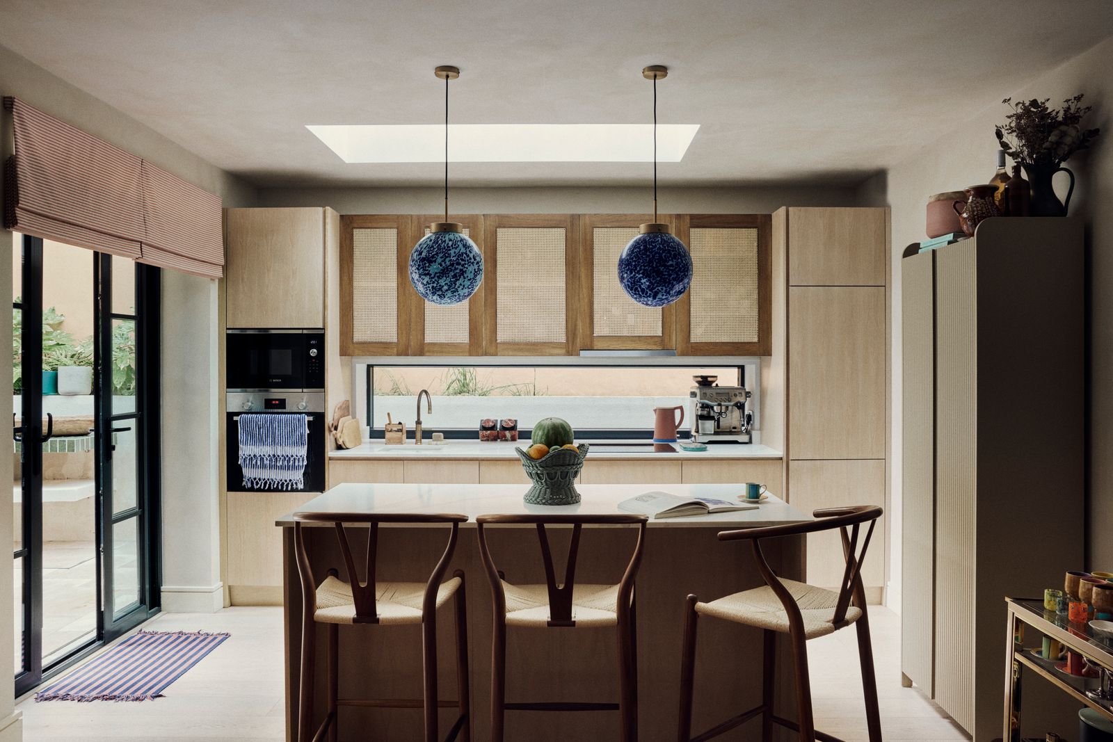 In Orlagh's kitchen she has combined built in cabinetry with freestanding furniture. The cream cabinet on the right is...