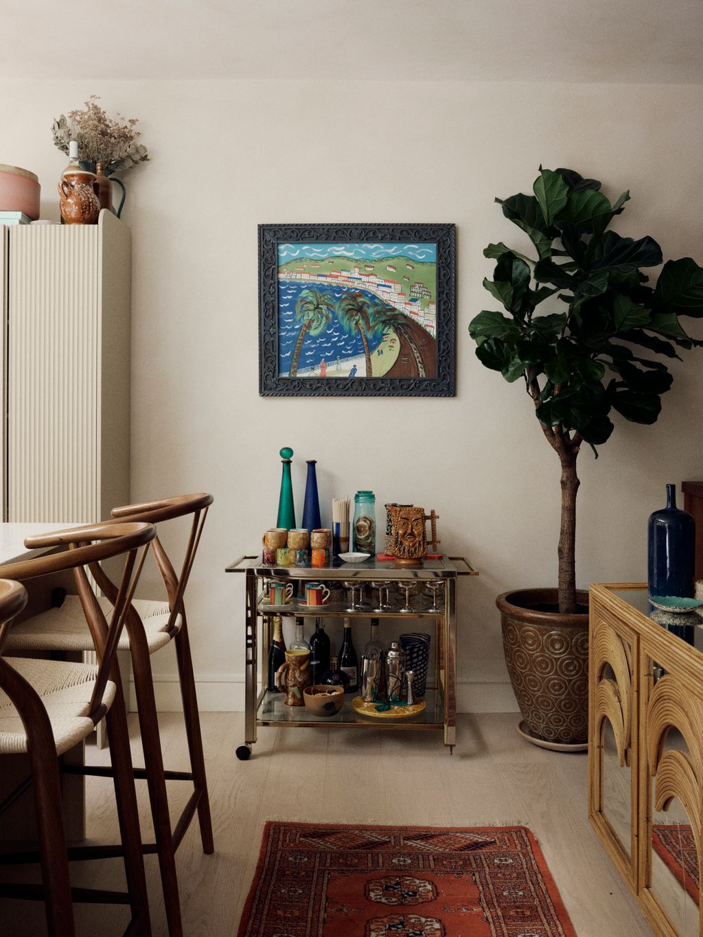 Much of Orlagh's furniture has been collected over time in antique markets across the globe. The rug bar cart and bamboo...