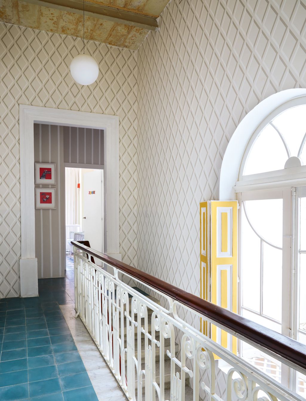 ‘Pompeian wallpaper by Cole Son and blue floor tiles from Mosaic Factory introduce subtle pattern and colour